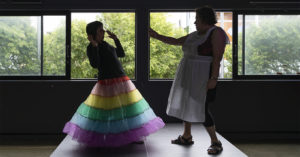 improvisors training in front of a window